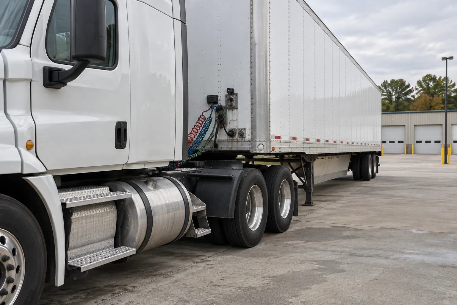 AI-created illustration of a parked tractor-trailer in a daylight inspection yard