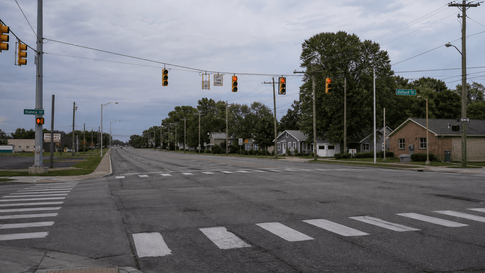 Wide afternoon view of a southeast Fort Wayne, Indiana arterial intersection similar to Hessen Cassel Road and East Maple Grove Avenue, where a critical-injury crash occurred on June 26, 2026.