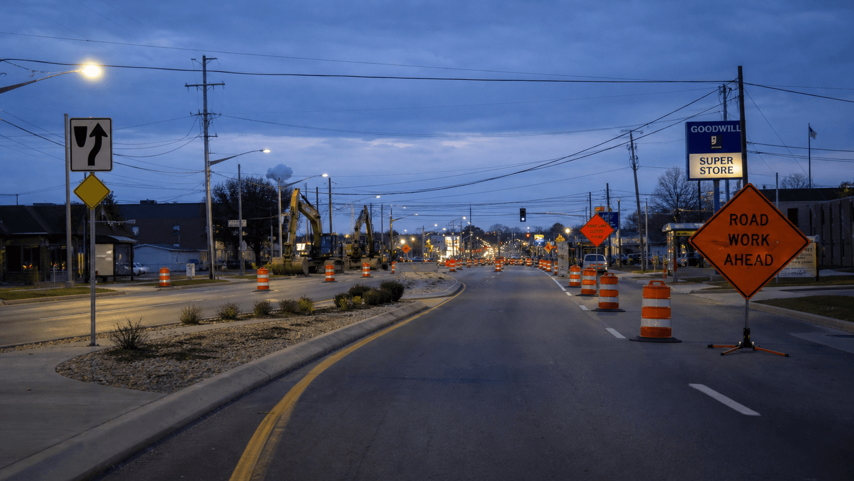 Evening construction zone along West Jefferson Boulevard near West Main Street in Fort Wayne, where a fatal collision with median equipment was reported.