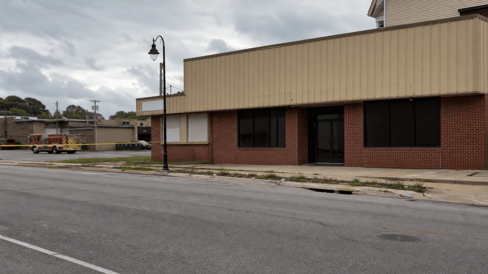 Vacant commercial building along Hulman Street in Terre Haute, Vigo County, representing the site of the intentionally set fire where a firefighter was injured.