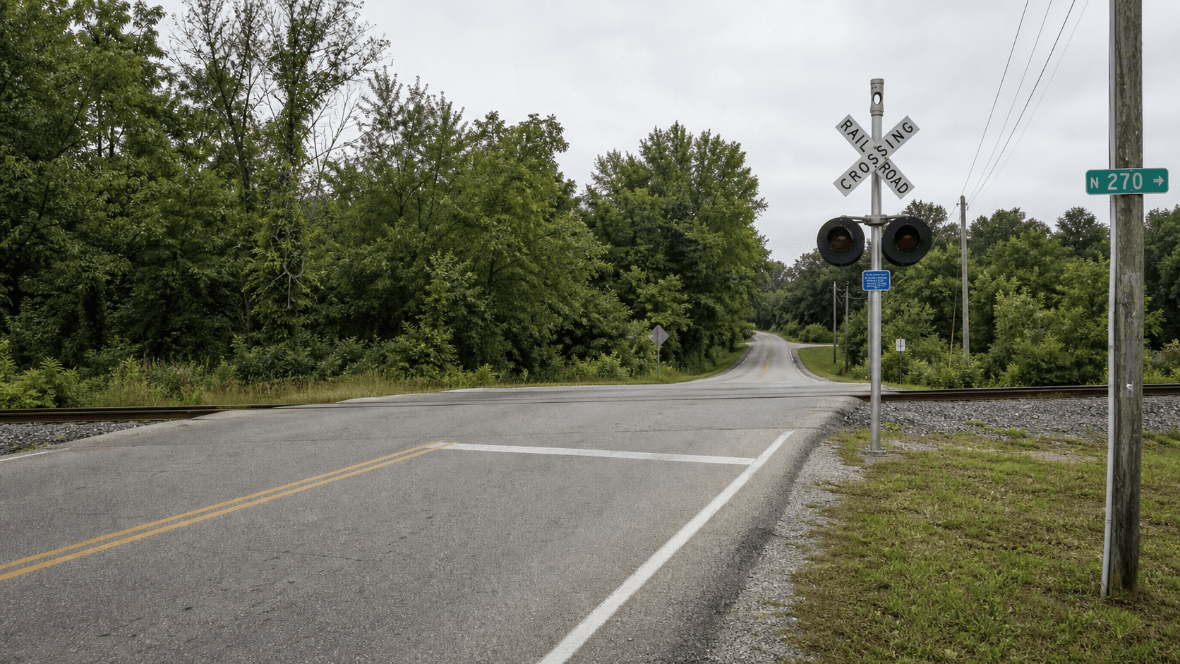 Railroad crossing near County Road 270 North and County Road 950 West by Owensville in Gibson County, where a report said trees blocked a tractor operator's view.