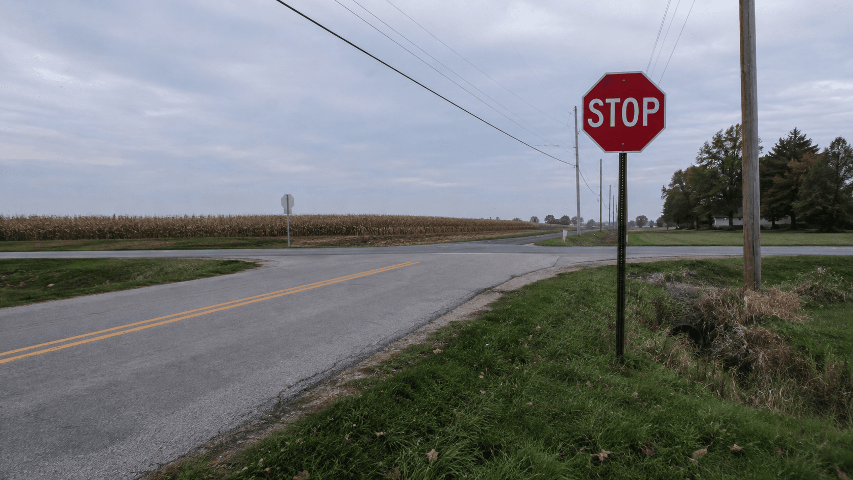 Stop-controlled rural intersection in Elkhart County, representing the County Road 4 and County Road 7 crash location.