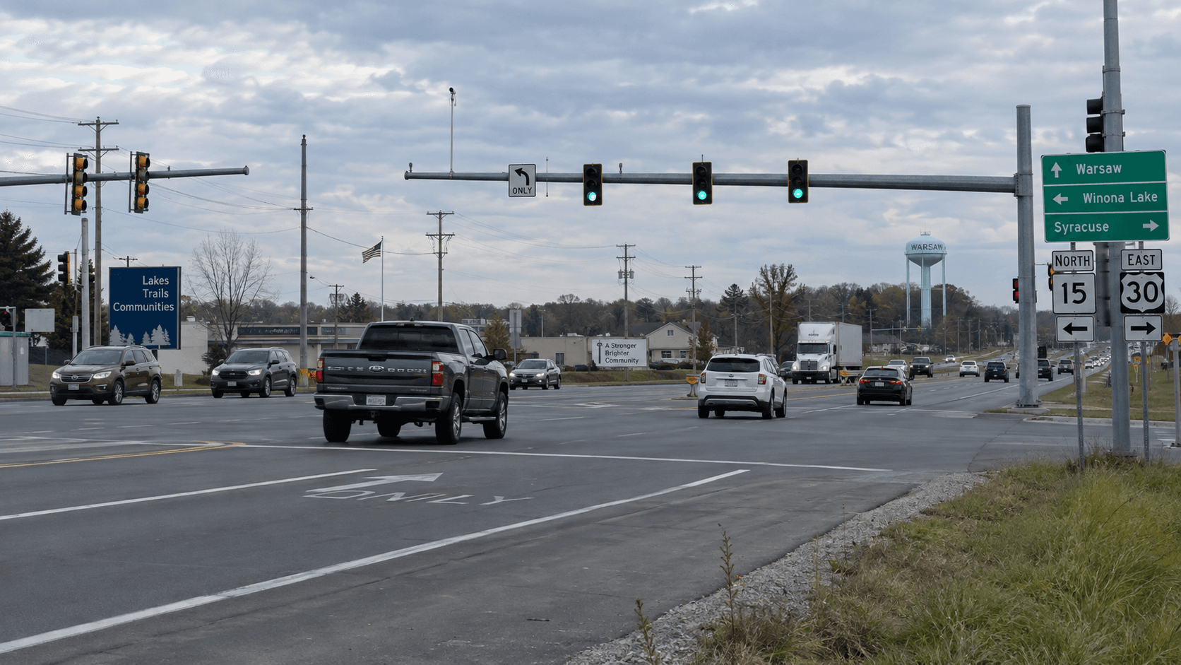 Daylight view of a highway intersection in Warsaw, Kosciusko County, illustrating the location type of the reported U.S. 30 red light crash.