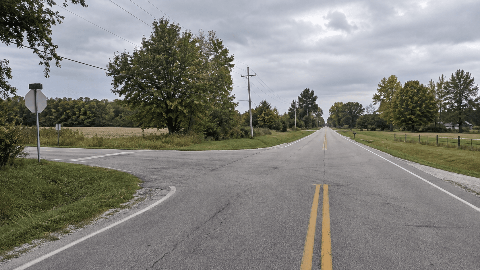 Rural county-road intersection scenery in Marshall County, representing the area of the pursuit crash near 12th Road and Sage Trail.