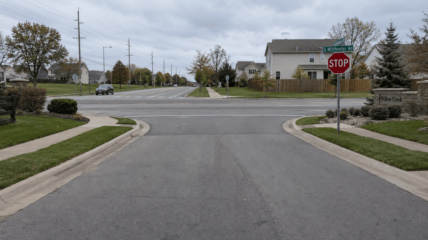 Residential subdivision exit along South Mitthoefer Road in Indianapolis, near the Marion County location of the reported rideshare passenger shooting.