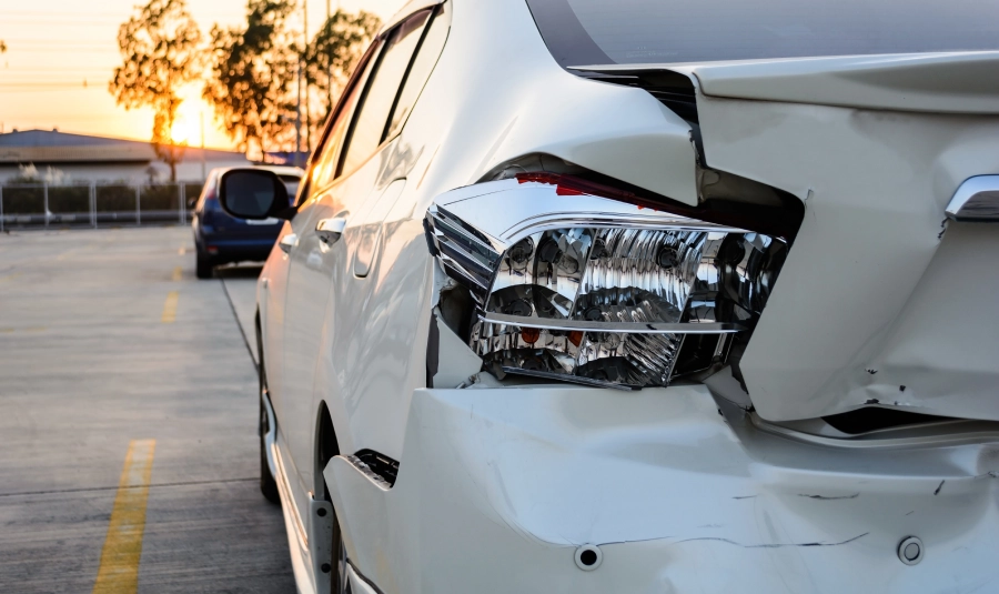 A rear-view close-up of a damaged car.