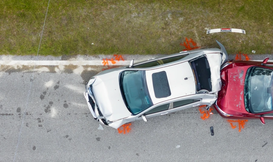 Aerial view of two cars after an accident.