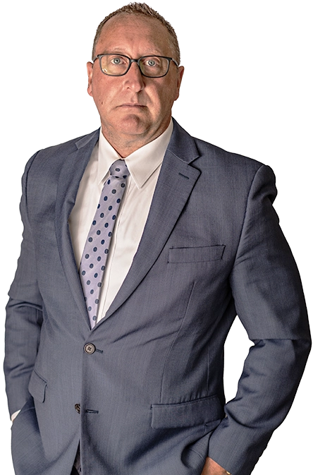 Chad Delventhal stands with his hands in his pockets.