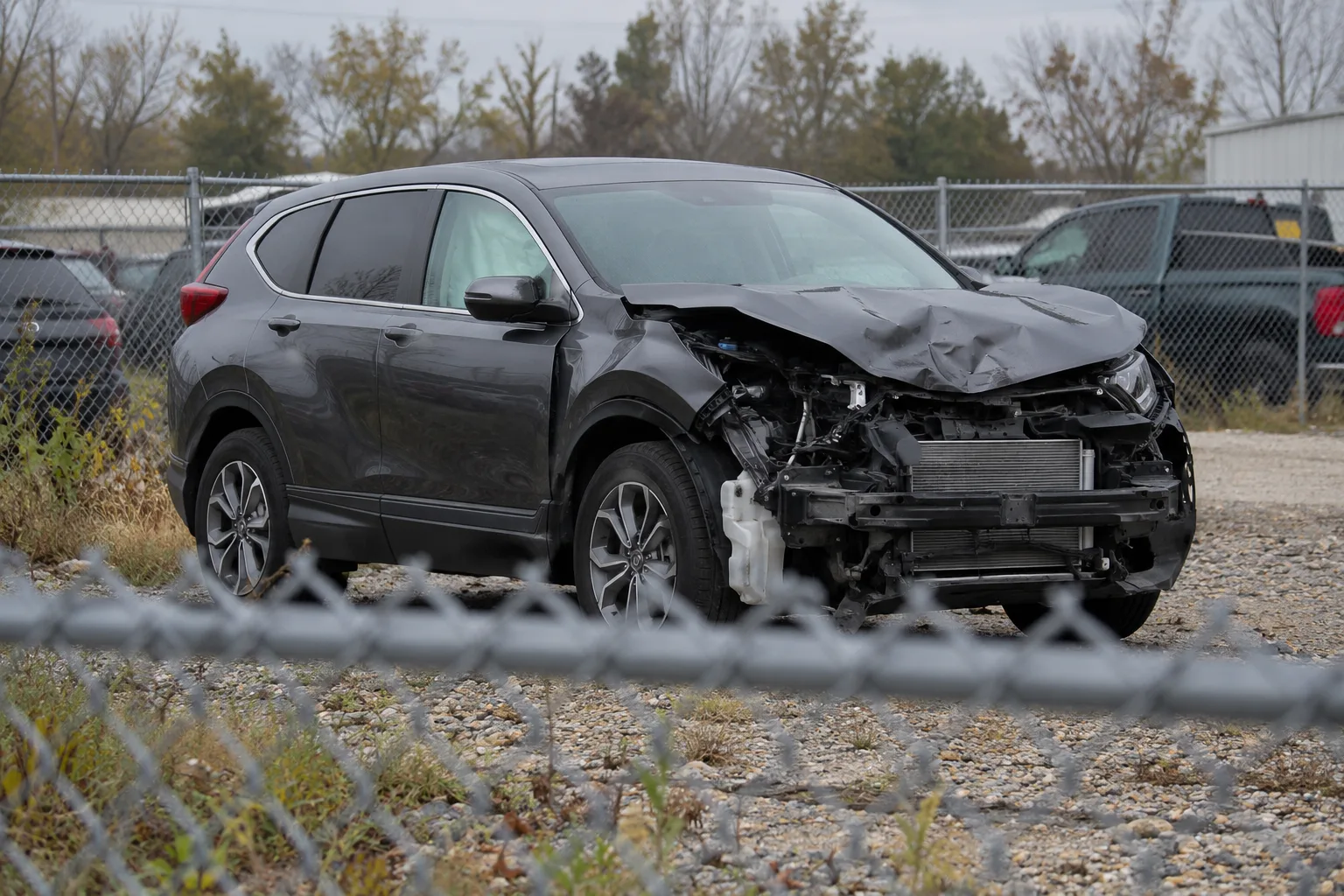 Damaged vehicle secured at an Indiana tow yard before inspection