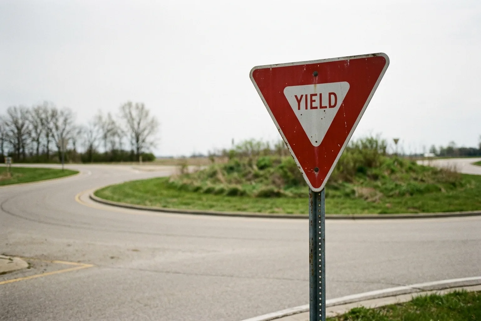 Yield sign beside a roundabout approach