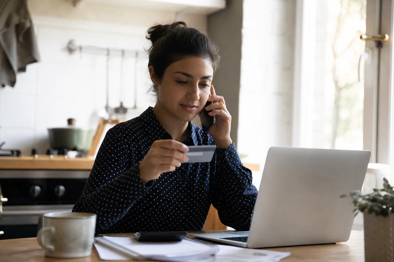 A person calling their credit card benefits line about rental coverage