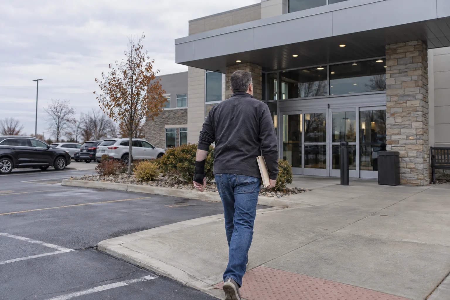 Injured worker arriving for an authorized medical appointment in Fort Wayne.