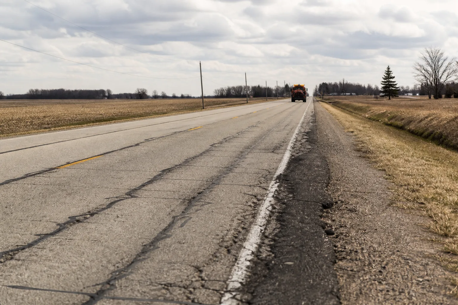 Worn pavement on an Indiana state-route setting