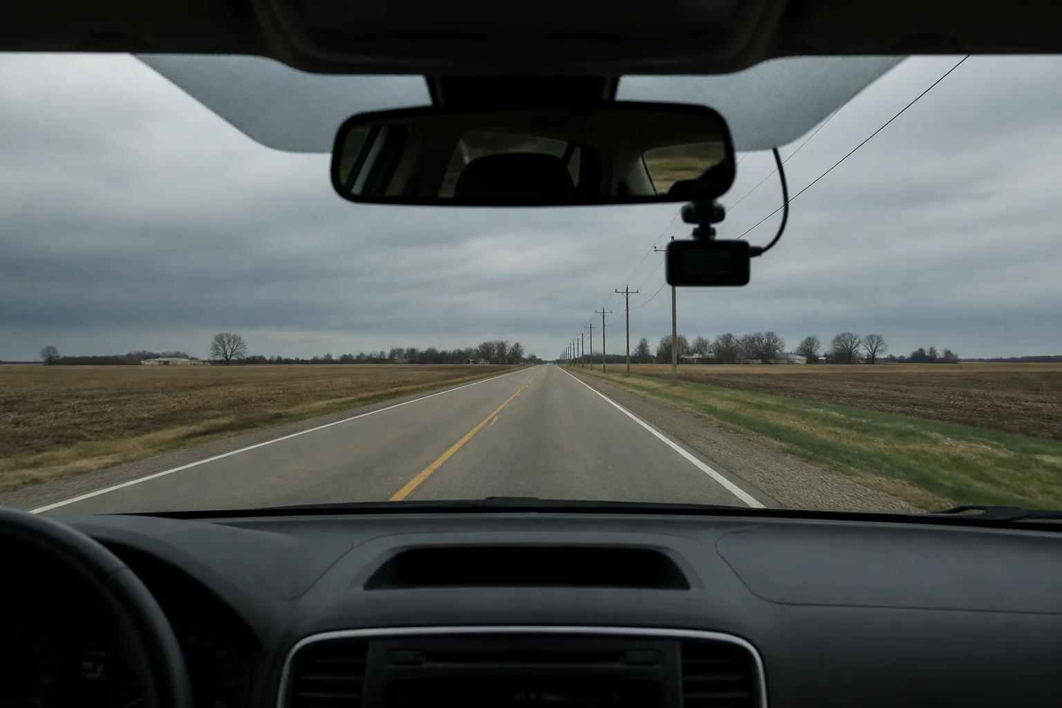 Dashcam facing an empty two-lane road in northeast Indiana