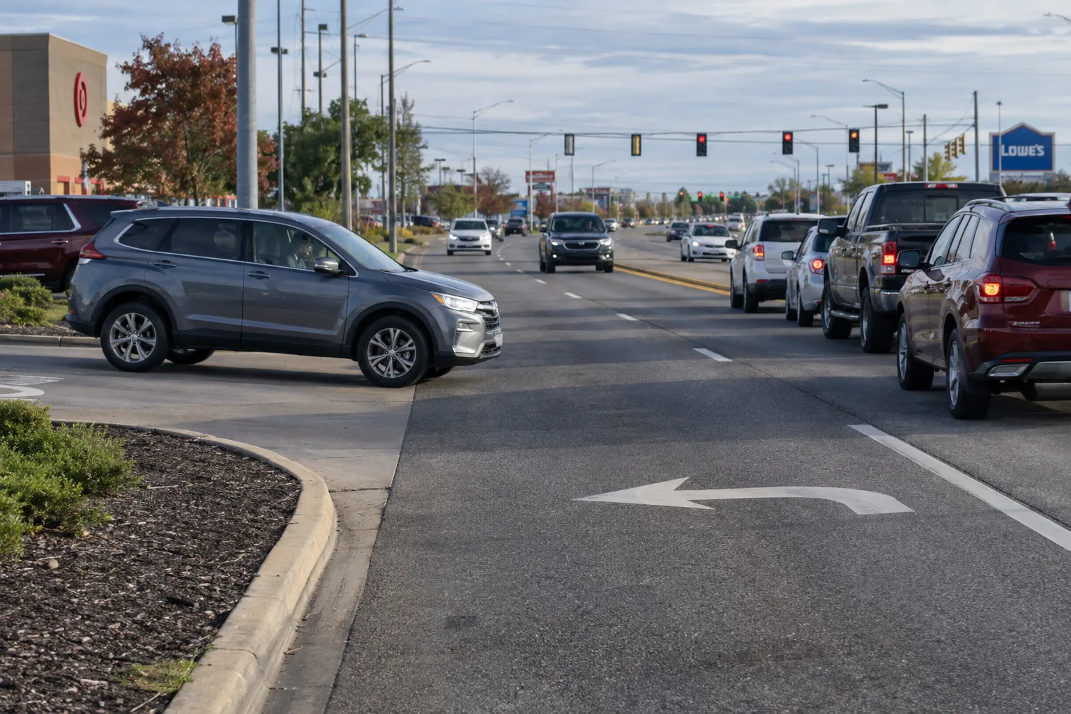 Vehicle entering a Fort Wayne road from a driveway across two traffic lanes