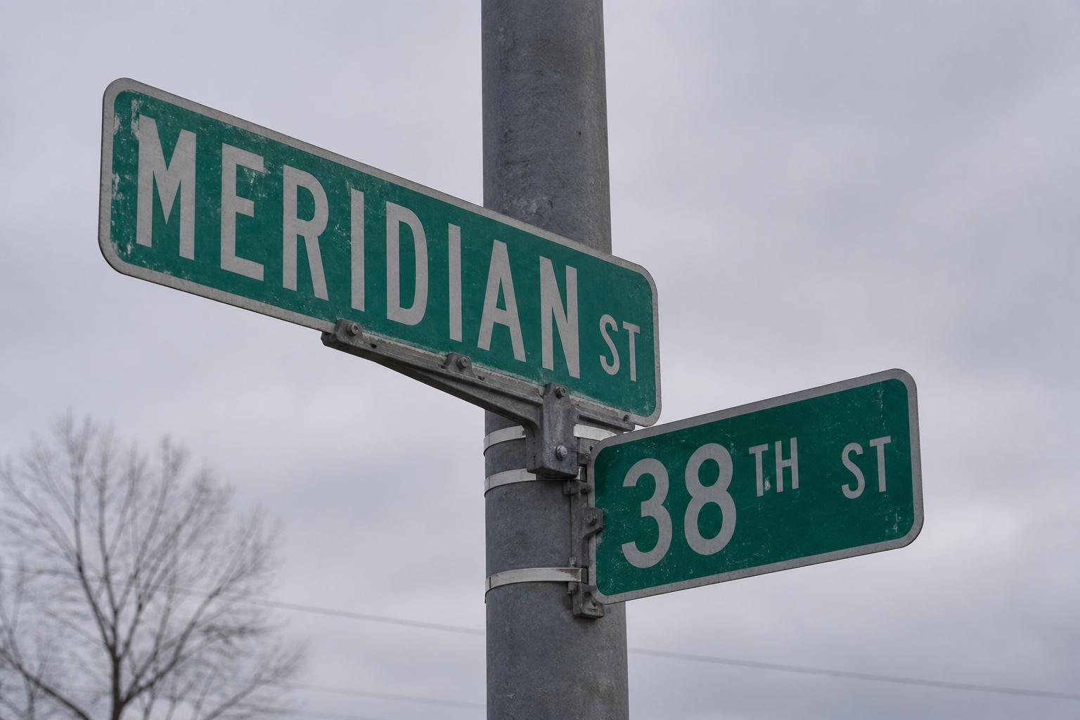 Street name sign at a major Indianapolis intersection similar to the north-side crossing where a fatal crash occurred in August 2026