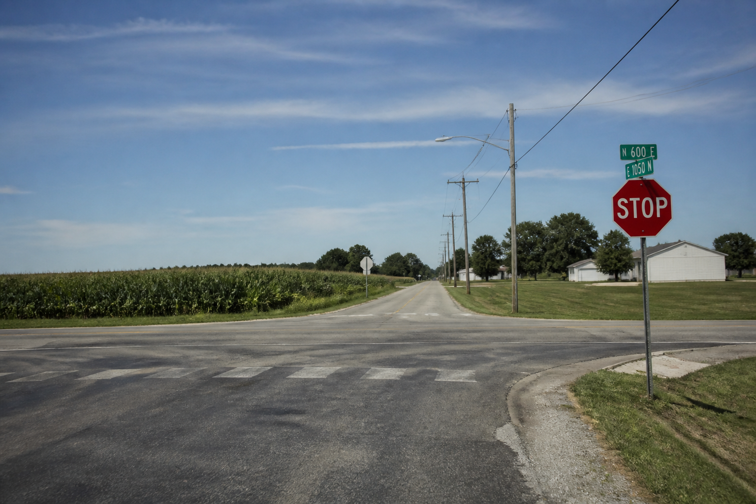 A residential Evansville, Indiana intersection similar to the North Heidelbach Avenue and Columbia Street crash site, illustrating the roadway layout relevant to the investigation.