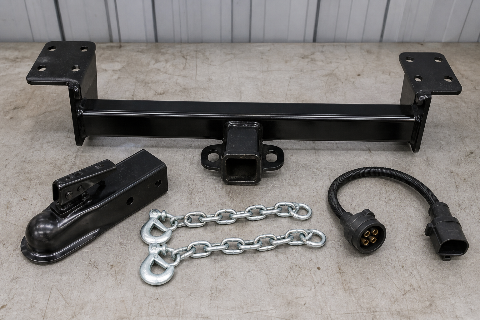 Trailer hitch, coupler, safety chains, and wiring like the components investigators may inspect after a trailer-sway crash.