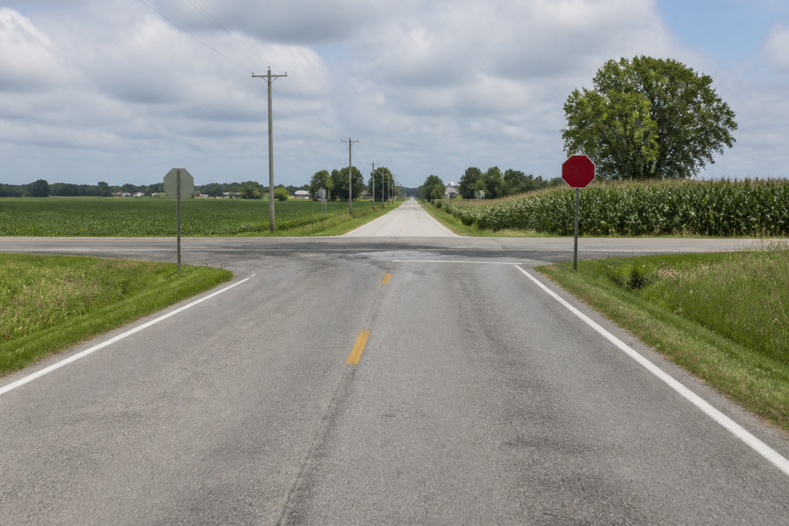 Driver’s-eye view of a rural intersection near Leesburg, showing the sight-line conditions that may matter in a Kosciusko County motorcycle crash investigation.