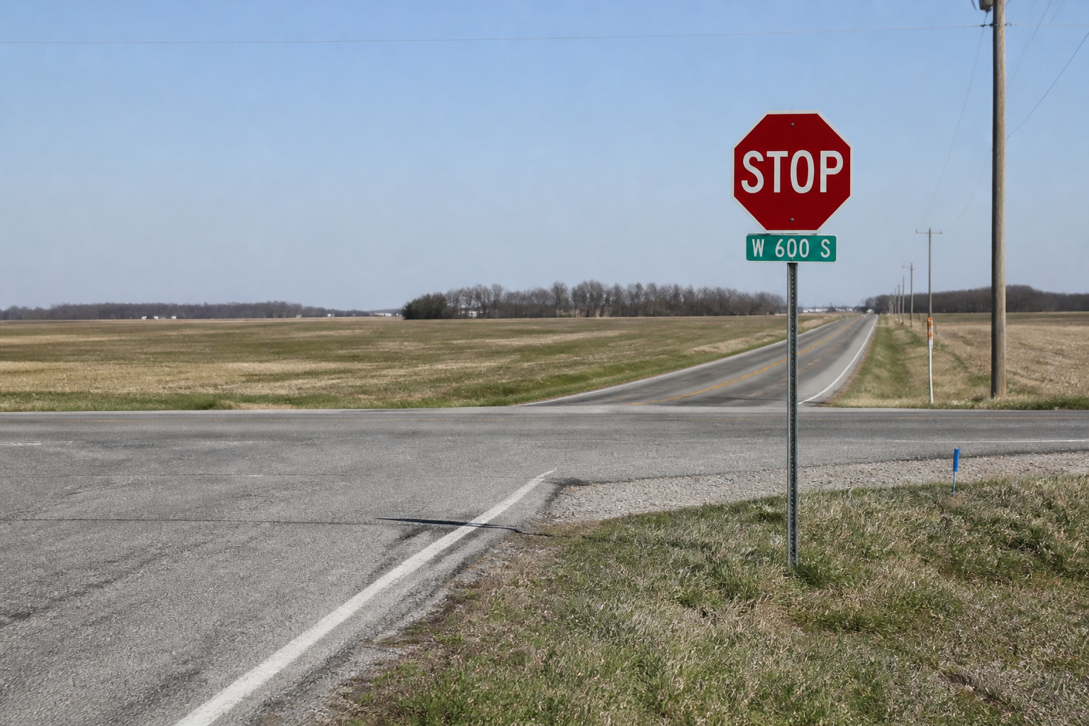 Stop sign at a rural White County intersection near Remington, relevant to the fatal collision reported at County Road 1100 West and Division Road.