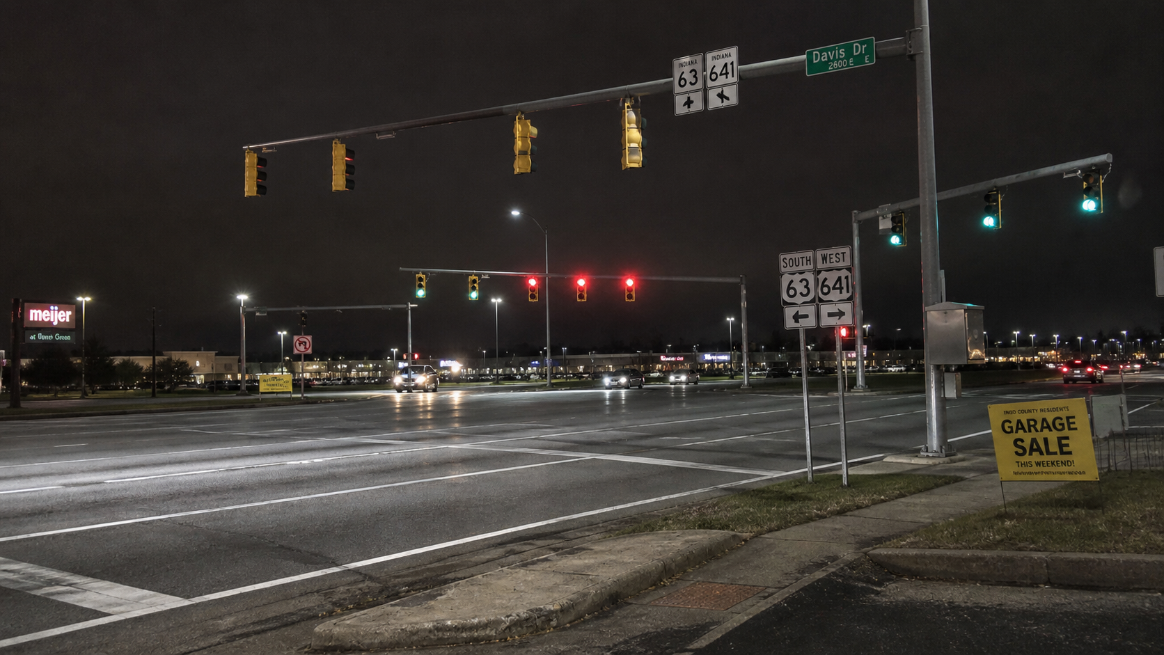 A Vigo County highway intersection after dark, illustrating visibility and closing-speed concerns discussed after the U.S. 41 motorcycle crash.