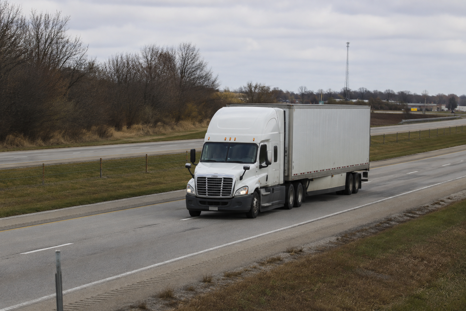 Commercial semi tractor-trailer traveling on an Indiana highway, illustrating evidence and insurance issues in truck crashes.