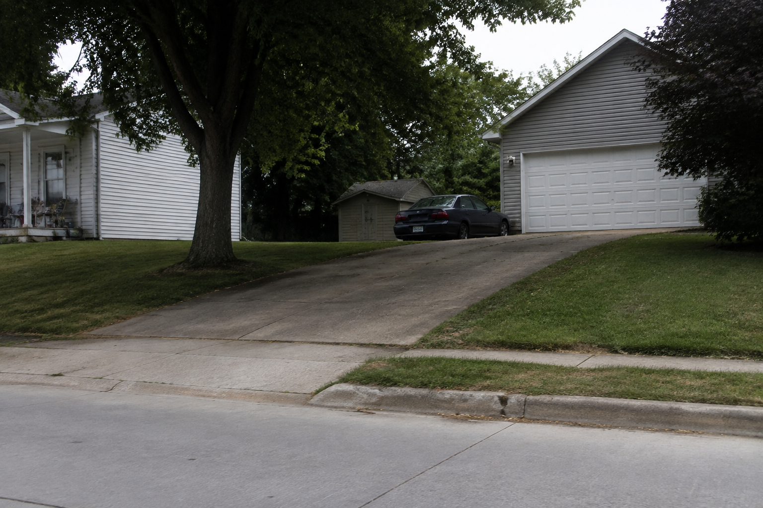 A residential driveway and garage in Portland, Indiana, illustrating the setting of the reported rollaway vehicle incident.