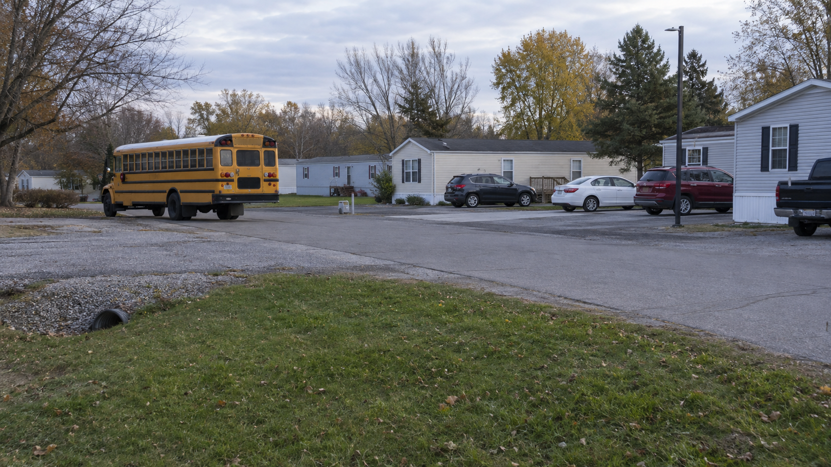 A school bus stop setting in a Vanderburgh County mobile home park, relevant to the reported student injury.