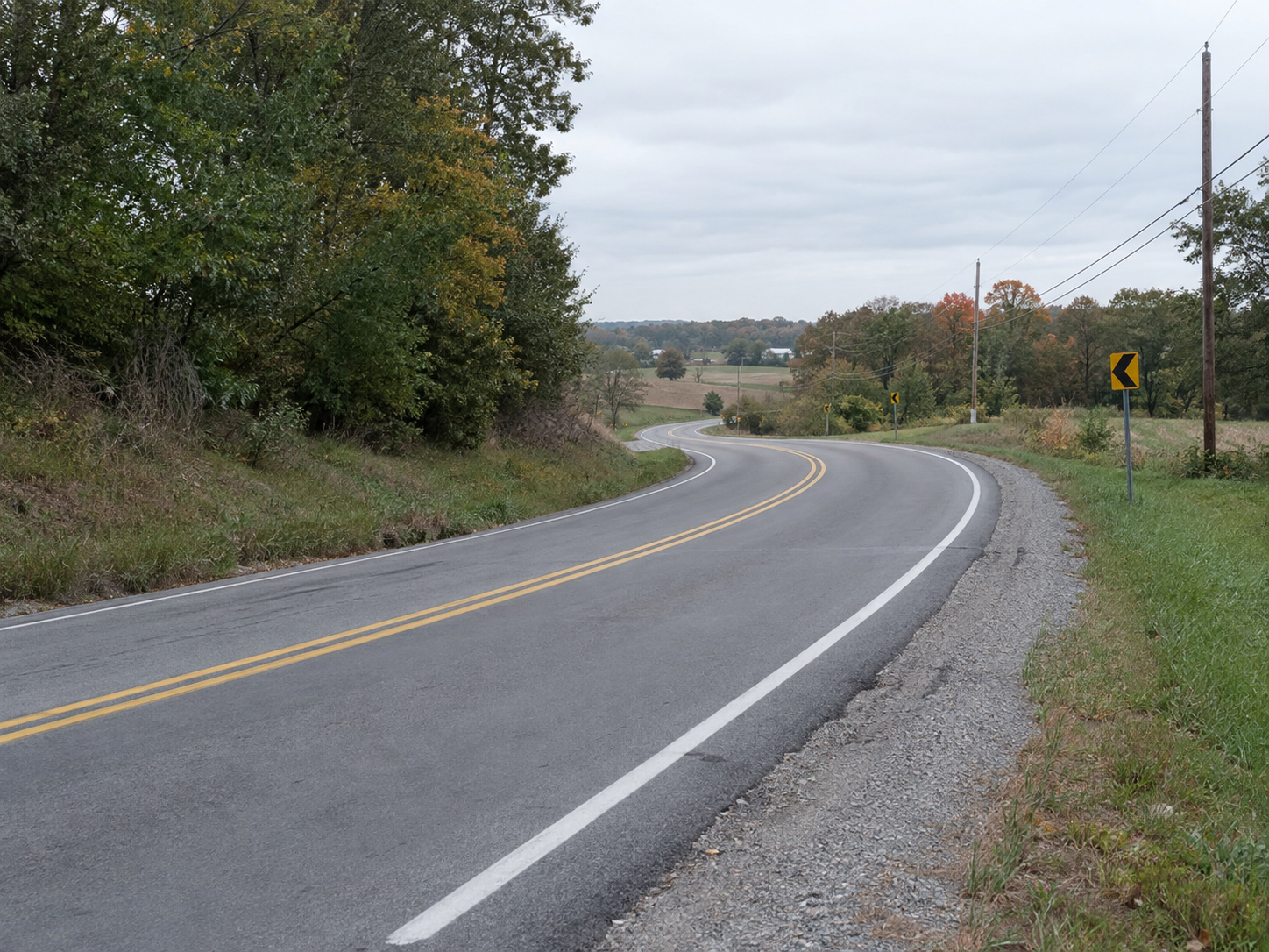 A two lane highway curve illustrates the sight-distance concerns involved in passing on roads like U.S. 33 in Elkhart County.