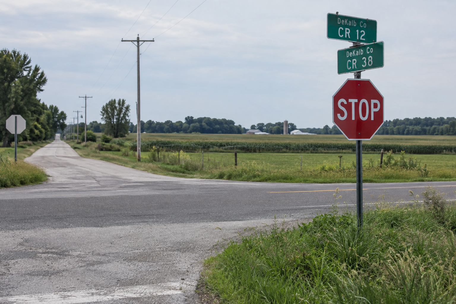 Stop sign at a rural DeKalb County intersection, illustrating the location of the reported failure-to-yield crash near Garrett.