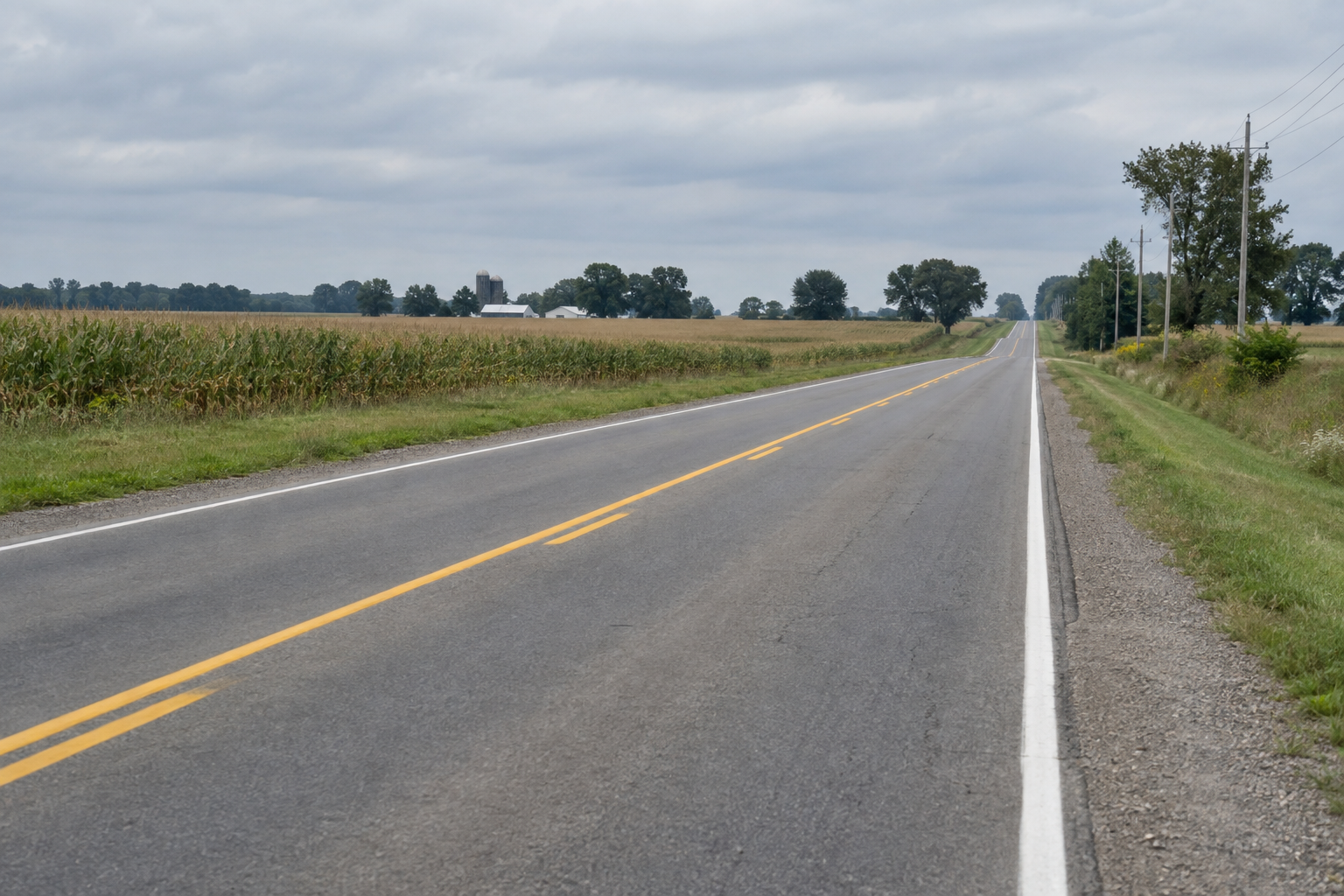 A two-lane rural Indiana highway illustrates the roadway setting of the State Road 135 crash near Vallonia.