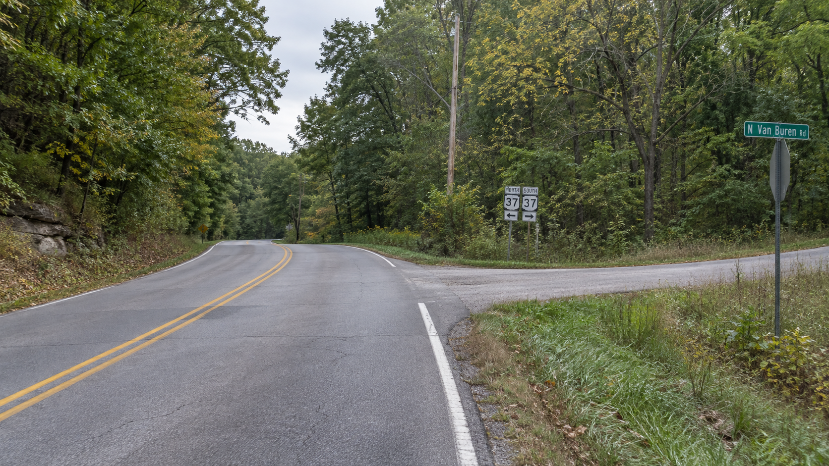 Wooded roadside near South Fairfax Road and East Will Sowders Road in Monroe County, the reported area of the motorcycle crash.