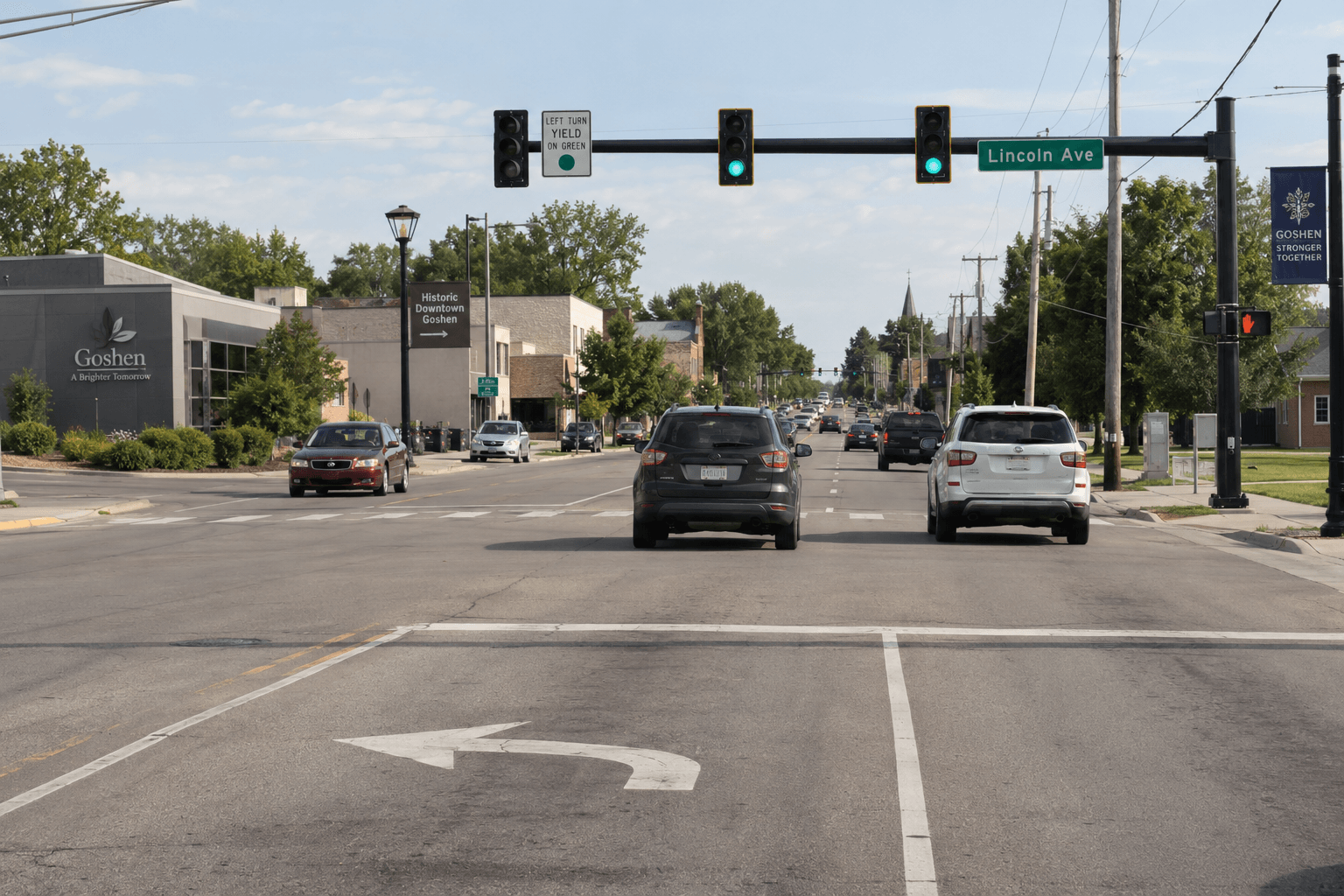 Signal-controlled intersection in Goshen showing left-turn and through lanes relevant to the reported collision.