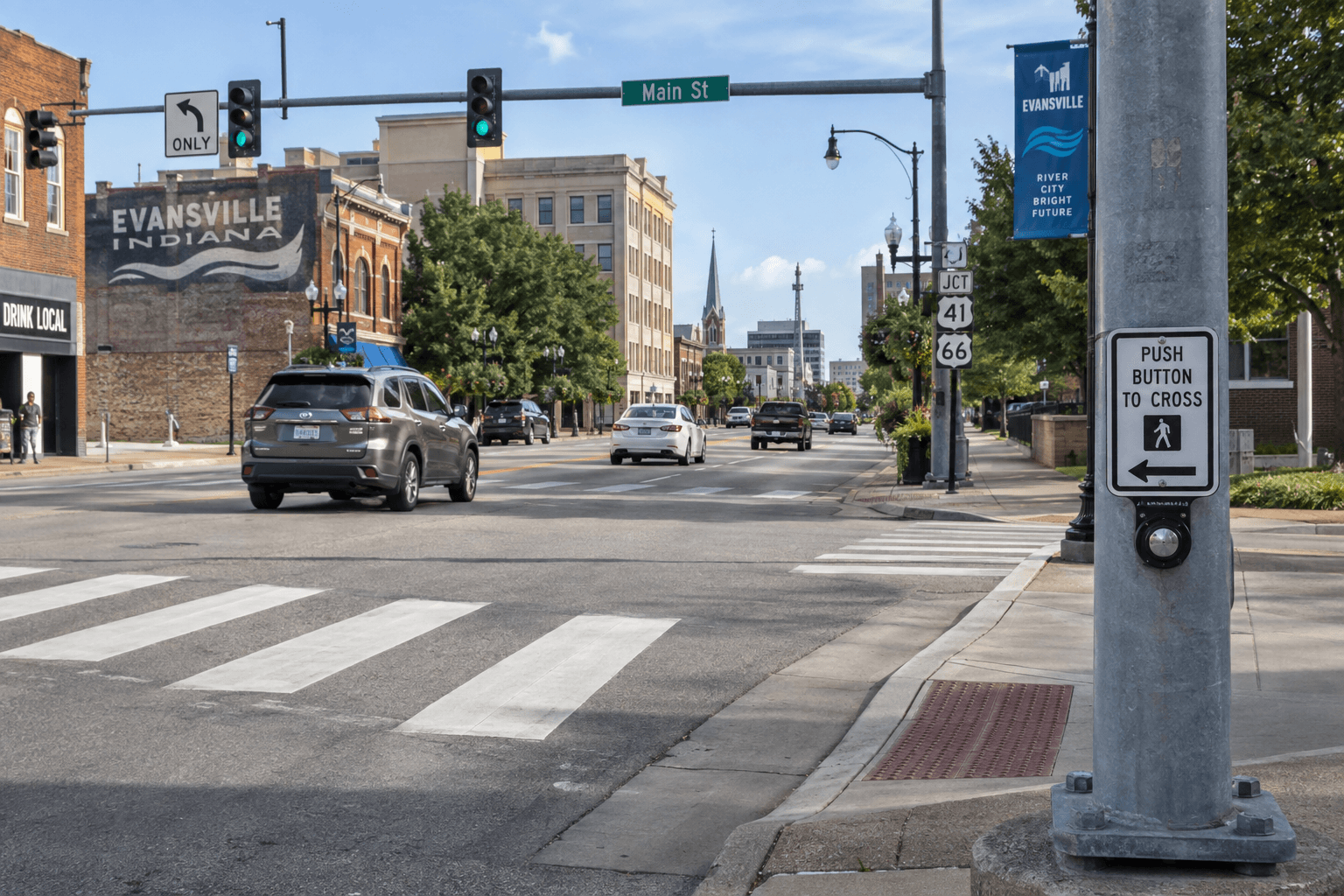 Crosswalk and traffic controls at an Evansville intersection, illustrating the setting of a pedestrian injury investigation.