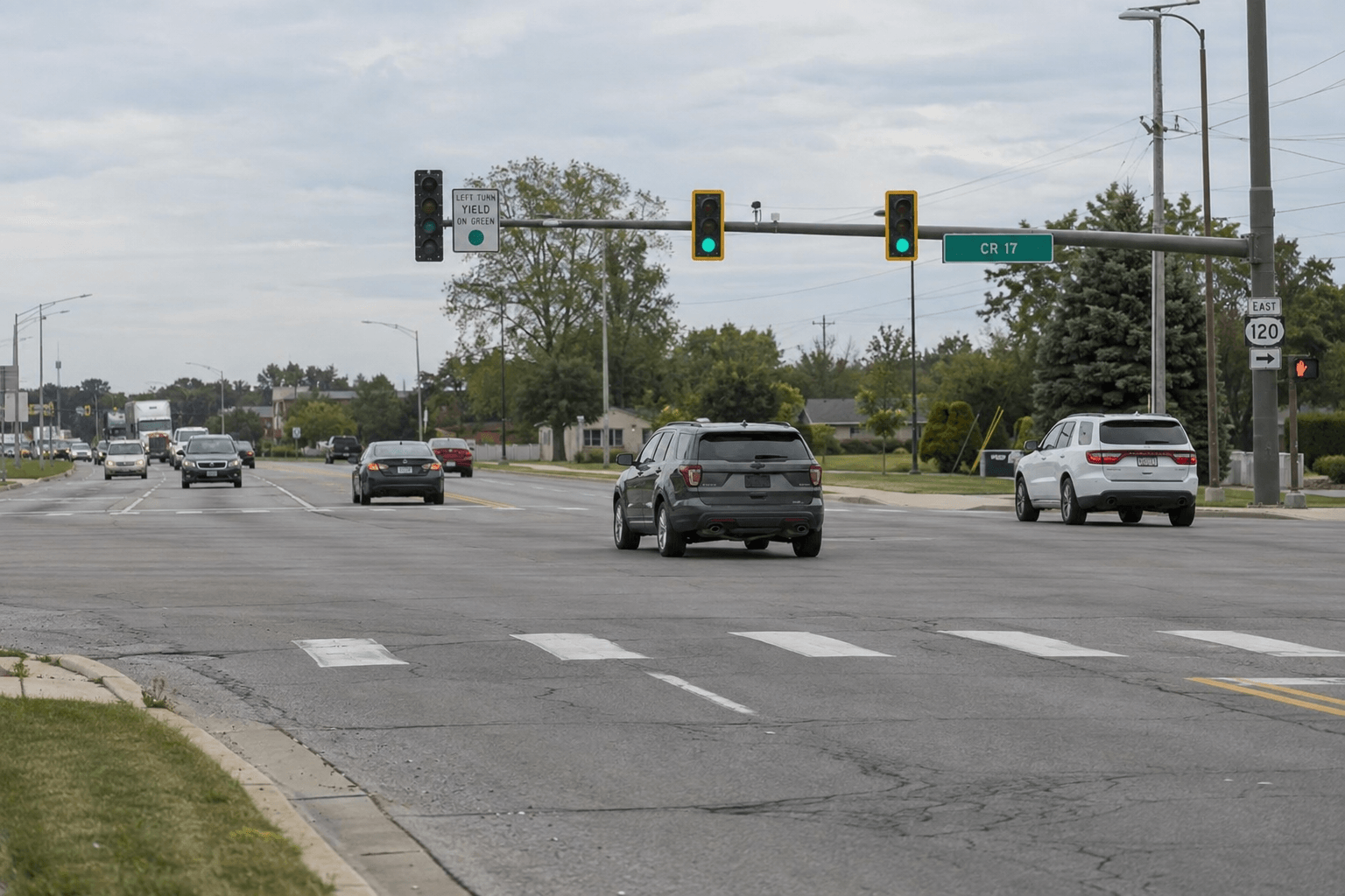 Traffic signals and lane markings at an Elkhart highway intersection, relevant to the reported U.S. 20 crash.