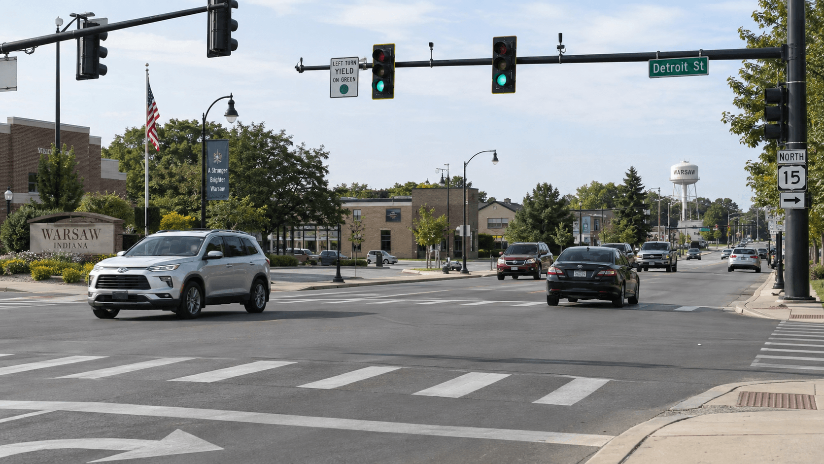 Traffic signals and lane markings at a Warsaw intersection, relevant to the reported State Road 15 red-light crash.