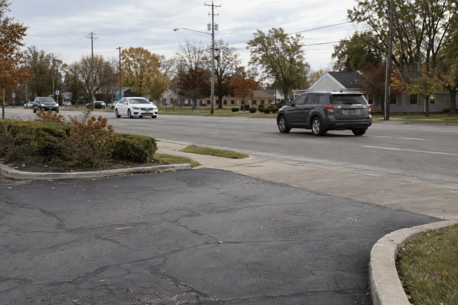 Parking lot exit along a Goshen roadway, illustrating the setting of the Eisenhower Drive North crash.