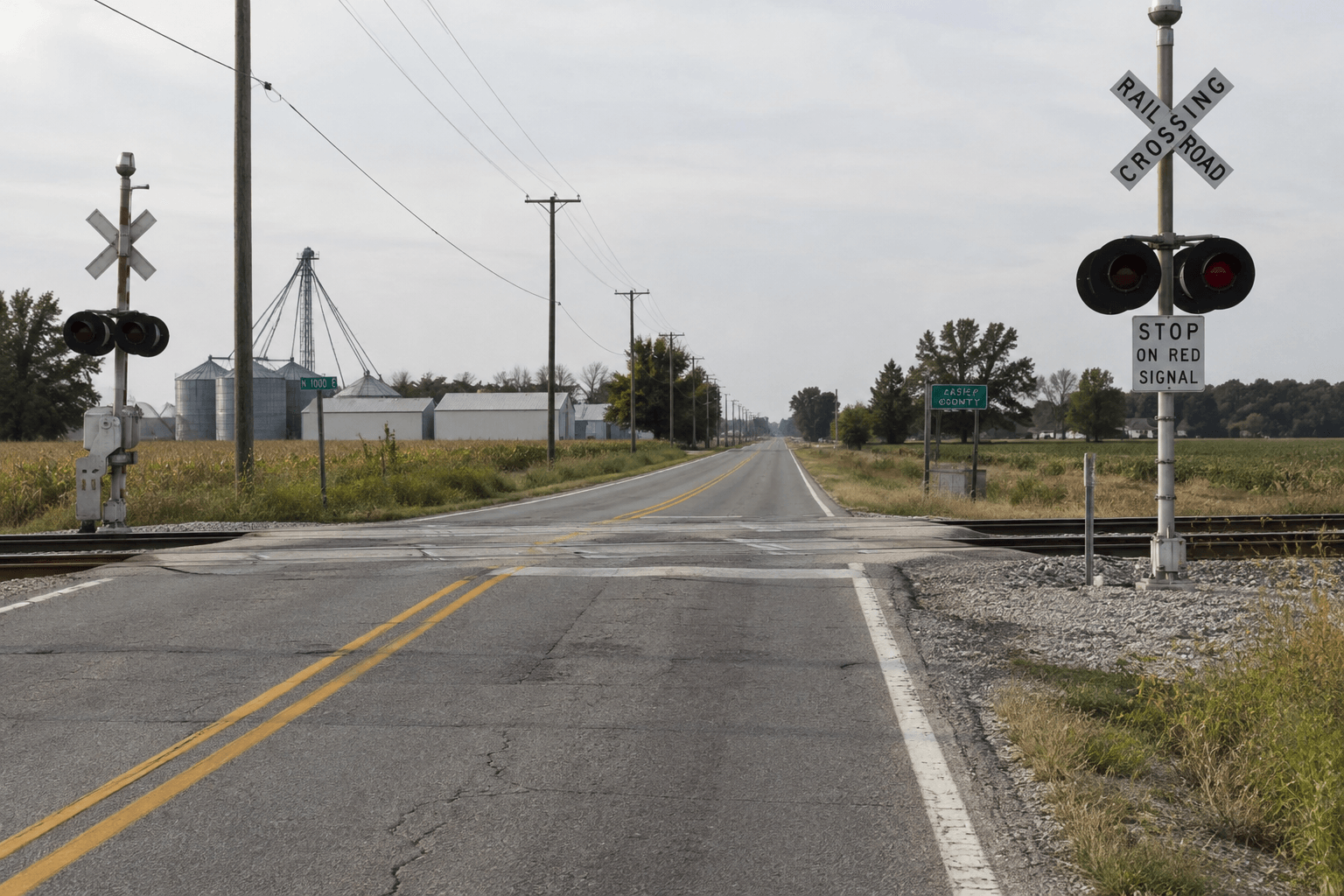 Railroad tracks crossing a county road near the reported crash location in Warsaw, Kosciusko County.