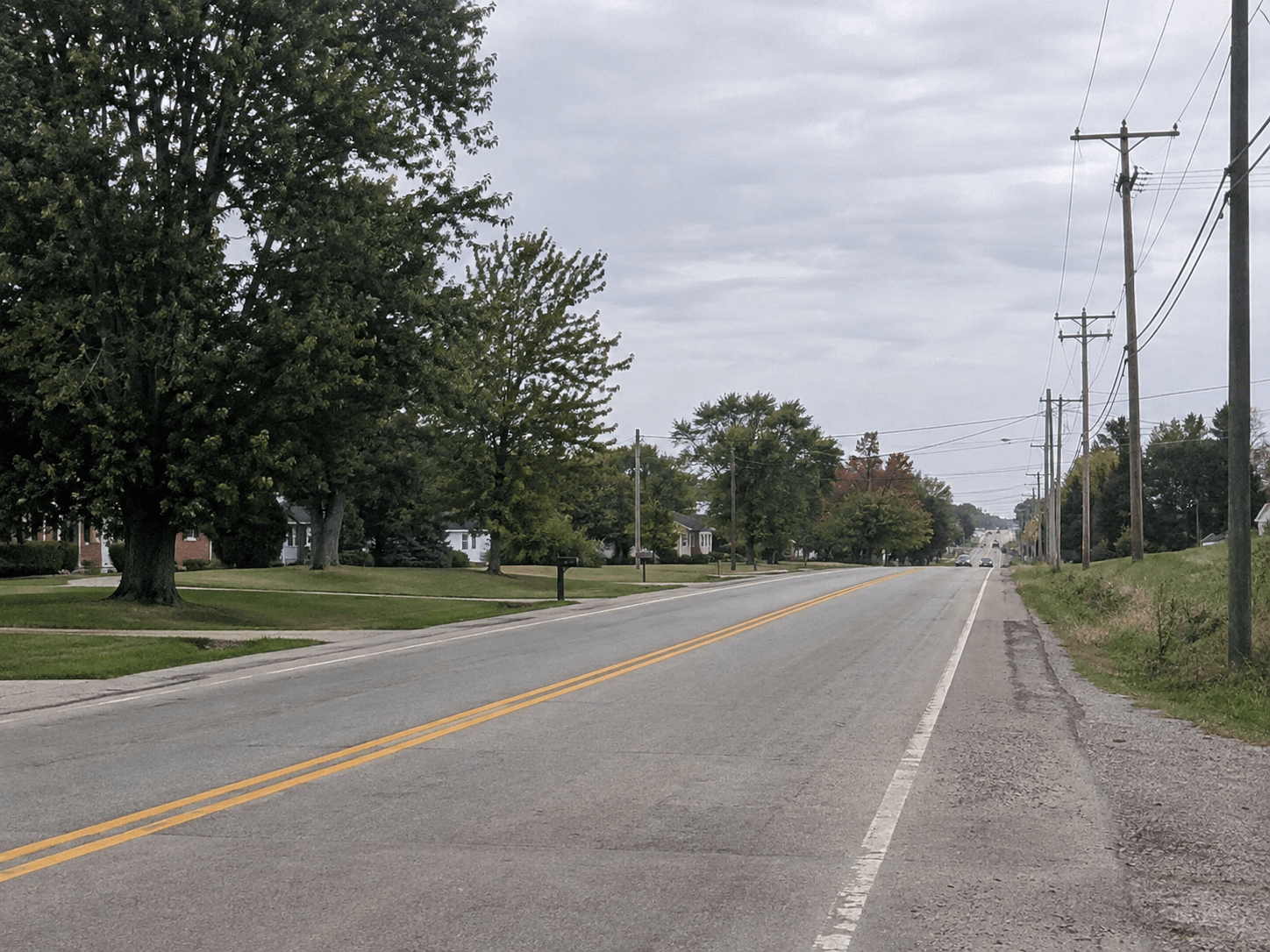 Indiana roadway near Jeffersonville illustrating the location and legal context of the reported Utica Pike e-bike crash.