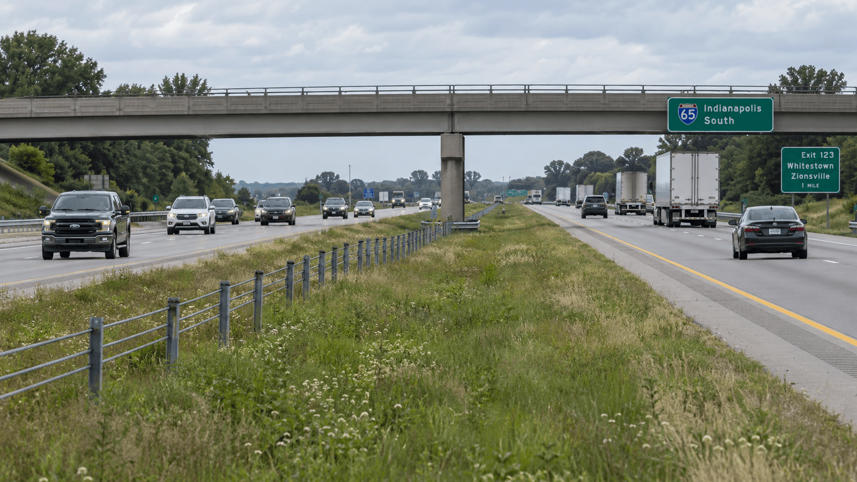Divided highway and median near an overpass, illustrating the Indiana Toll Road rollover location near South Bend.