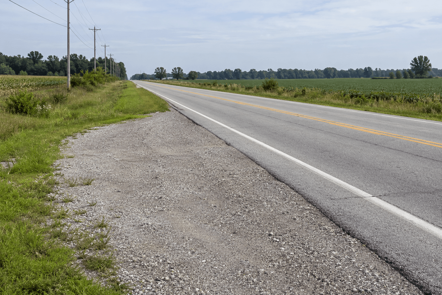 Roadside shoulder near Pierceton, Indiana, illustrating safety concerns when a vehicle is disabled along a state highway.