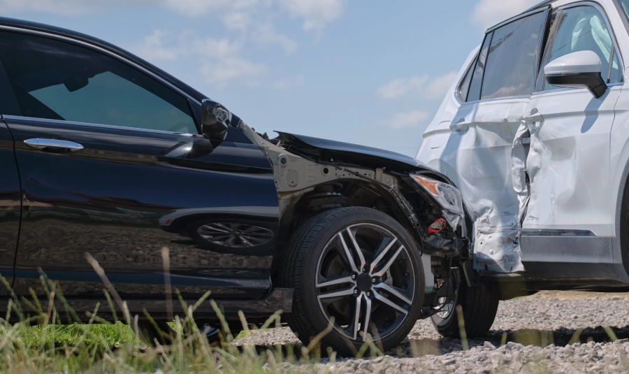 Two cars sit damaged after one t-boned the other in an accident.